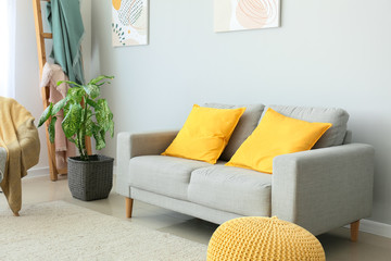 Interior of modern room with comfortable sofa