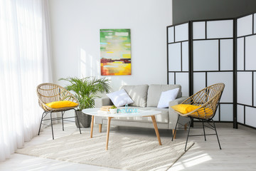 Interior of modern room with comfortable sofa