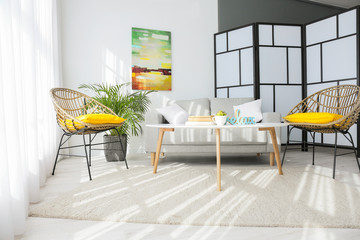 Interior of modern room with comfortable sofa