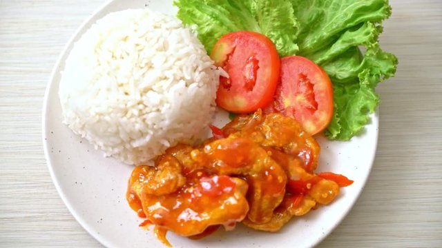 Fried fish topped by three flavors chili sauce with rice