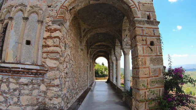 Slow motion walking in byzantine medieval fortified despotate of Mystras on Mount Taygetus near Sparti town, Laconia, Peloponnese, Greece.
