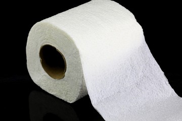 Roll of toilet paper on a black background 