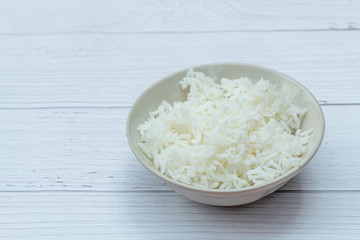 Hot Jasmine Rice on Bowl with white wood background