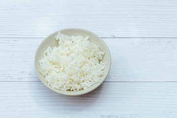 Hot Jasmine Rice on Bowl with white wood background