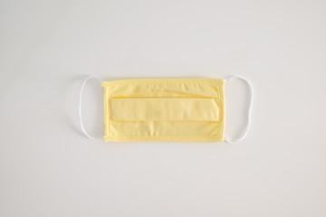 Homemade protective mask on white table , washable and reusable