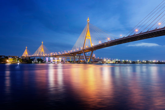 Bridge crosses the Chao Phraya River, Bhumibol Bridge or Industrial Ring Bridge Bangkok, Thailand in twilight time. Bhumibol Bridge 1,2 translate from text in image.