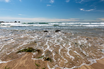 Waves crashing on the beach in Stanley, Tasmania, Australia.