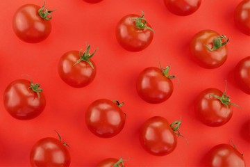 Tomato pattern. Tomato background. Red  tomatoes on a bright red background. Tomatoes season vegetables. Farm organic bio vegetables
