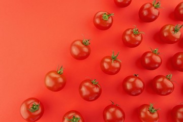 Tomato pattern. Tomato background. Red ripe tomatoes on a bright red background. Tomatoes season . Farm organic bio vegetables