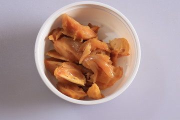 Ripe fresh whole and half of sapota fruit isolated on wood backgroud, Indian Chikoo

