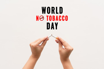 Quit smoking, no tobacco day, woman hands breaking the cigarette
