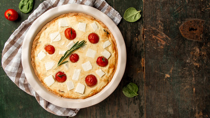 Homemade spinach french pie quiche lorraine on wooden board. Food recipe background. space for text. top view