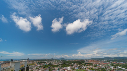 panoramic scene at Khao Rung Phuket viewpoint hilltop, home , building and green  tree. Sea and mountain long distance, beautiful cloudy blue sky background at day time, nature and travel concept..