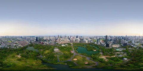 360 panorama by 180 degrees angle seamless panorama of aerial of green trees in Lumpini Park, Sathorn, Bangkok Downtown Skyline. Thailand. Financial district in urban city. Skyscraper buildings. © tampatra