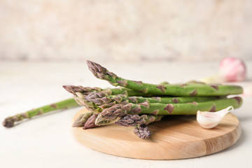 Fresh green asparagus on table