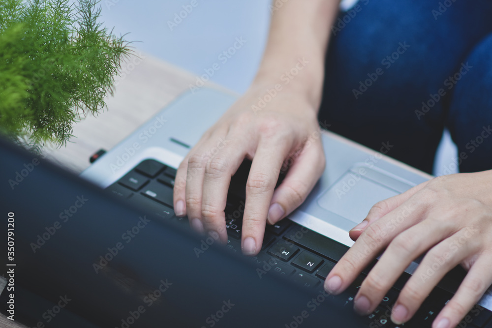 Poster person using computer notebook working at home