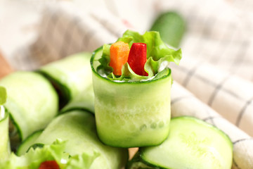 Tasty cucumber rolls on table, closeup