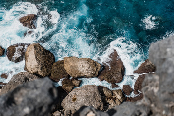 Stunning sharp cliffs over the ocean, view from the top