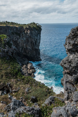 Stunning sharp cliffs over the ocean, view from the top