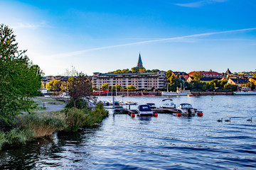 Small Boats Parked by a Local Park next to the Sickla Canal in the Södra Hammarbyhamnen Neighborhood of Stockholm, Sweden