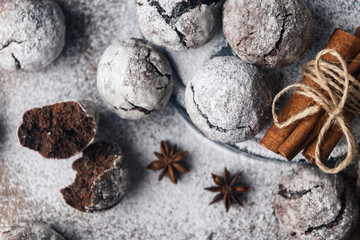 A few marble brown cookies close-up with star anise, cinnamon and powdered sugar