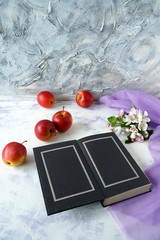 still life with apples and book