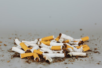 Stack of cigarette like graves.Cigarettes is addictive to be cancer.smoking reduction campaign in World No Tobacco Day.
