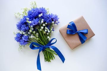 postcard mockup. a bouquet of blue cornflowers and space for text. invitation. congratulation