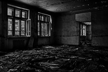 Fototapeta na wymiar Black and white room with windows in an abandoned building