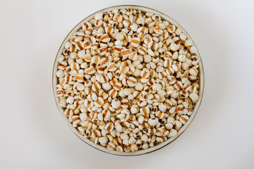 Job's tears, Coix lacryma-jobi, adlay or adlay millet in a bowl close up