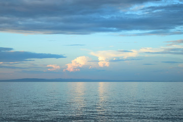 Naklejka na ściany i meble Cloudy sunset over the sea at Therma beach – Samothraki island, Greece, Aegean sea