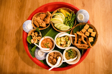 Khan Toke is the name of a container used to place the food that comes with various types of food, because Thai food pattern or way of life was originally sitting on the floor.