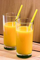 Orange juice in a glass with a straw. Nectar of fruit. Cocktail.