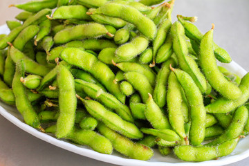 Chinese/Japanese food: A plate of Edamame close up