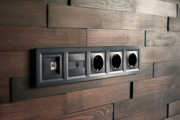 Electrical household switches and sockets close up. Minimalist interior design. Stylish bedroom and...