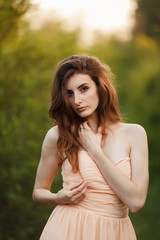 Fine Art Portrait of a beautiful bride in a summer garden