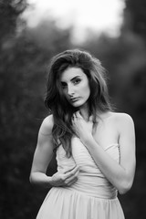 Naklejka premium Fine Art Portrait of a beautiful bride in a summer garden