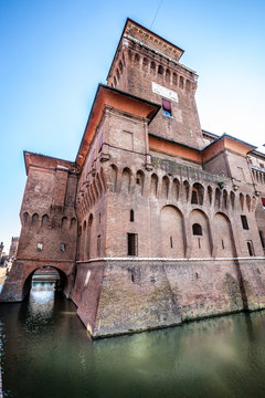 The Castello Estense in Ferrara in Italy. Moated medieval castle in the center of Ferrara, northern Italy. It consists of a large block with four corner towers.