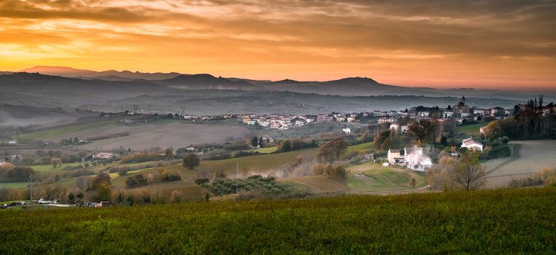 Tavullia, Pesaro And Urbino Province, Marche, Italy. View On The Village At The Autumnal Sunset