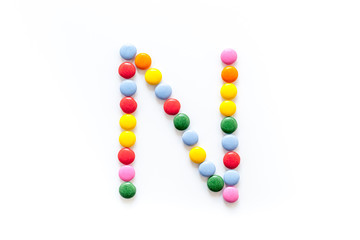 Candies font alphabet. Letter N isolated top view