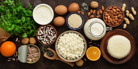 High calcium foods, banner. A variety of products rich in calcium. Top view, flat lay.