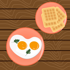 Scrambled eggs for breakfast and Belgian waffles On a wooden table
