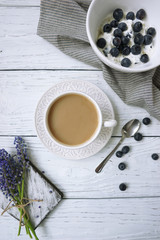 Fototapeta na wymiar Breakfast with coffee, blueberries and soft cheese or cottage cheese