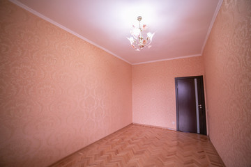 Empty room unfinished room Beige color and chandelier
