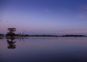 Blue and red sunrise at a lake