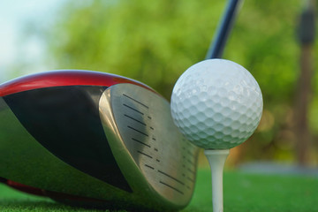 Golf balls on the golf course with golf clubs ready for golf in the first short. In the morning, with the beautiful sunlight.Sports that people around the world play in the holidays.