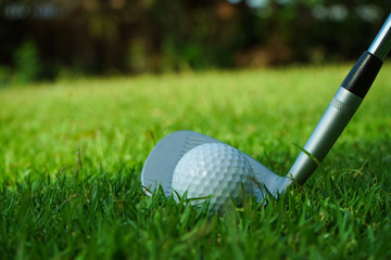 Golf balls on the golf course with golf clubs ready for golf in the first short. In the morning,...