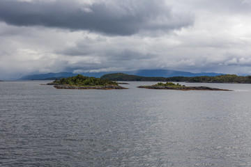 End of fjord. Beautiful Norwegian landscape. view of the fjords. Norway ideal fjord reflection in clear water In cloudy weather. selective focus