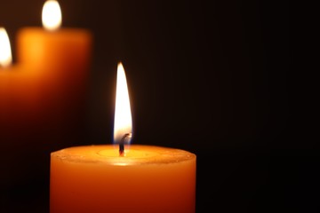 Candle black background of mourning funeral moment of silence	
