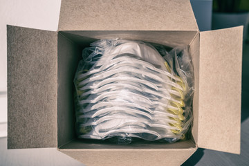 COVID-19 mask box of new N95 masks open PPE medical supplies for healthcare workers at hospital...